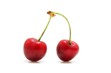 two red cherries isolated on white background