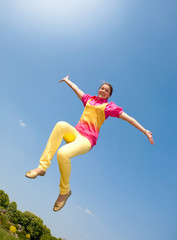 Obraz premium Happy smiling girl - jumping.