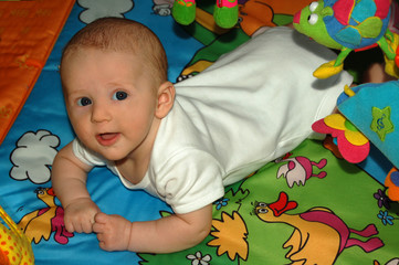Baby playing on the mat