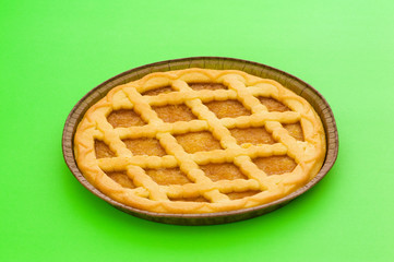 Sweet pie isolated on the green background