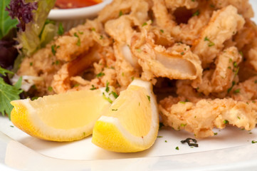 Lemons and fried calamari