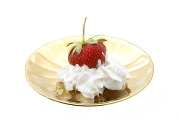 strawberry in a golden plate