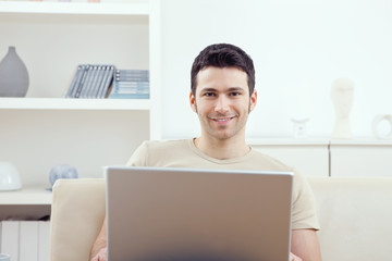 Man using laptop at home