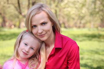 Mother and daughter in park in spring
