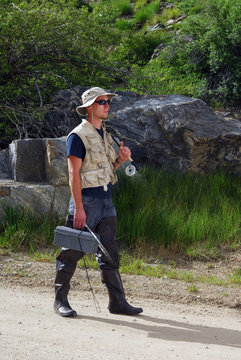 Fisherman Walking Down Path