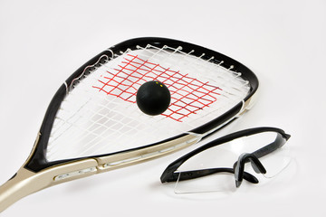 Squash racquet, ball and safety glasses