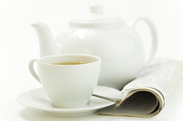Obraz na płótnie Canvas morning cup of tea and press on white