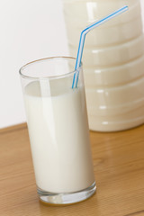 milk in glass with straw