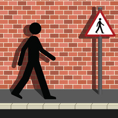 Signage Man Walking Along a Street