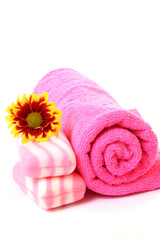 Obraz na płótnie Canvas soap, flower and towel on white