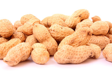 Many peanuts on white background