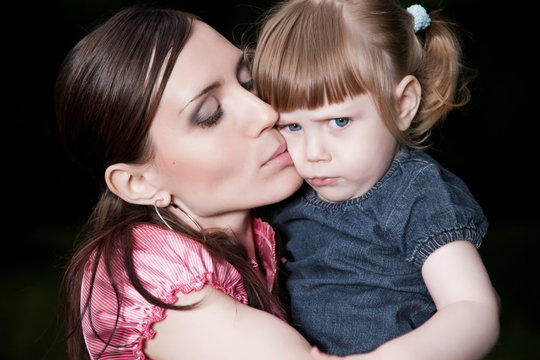 Mother Kissing Daughter