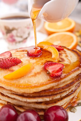 stack of pancakes with syrup