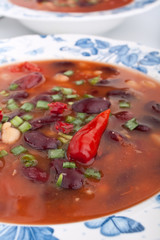 bean soup in a blue patterned plate