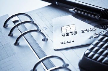 credit card and ink pen