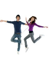 happy casual couple jumping of joy
