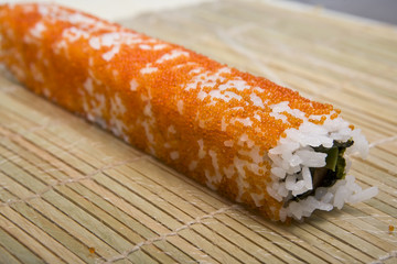 cook on a kitchen prepares Japanese susi