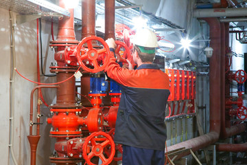 Man shut/open valve on the piping fire-fighting system