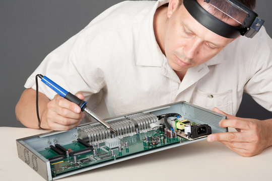 Engineer repairing circuit board