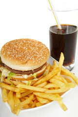 Hamburger meal served with french fries and soda close-up