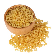 Macaronis in a wooden mortar and spilled . (isolated)