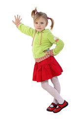 little girl stands near a wall, red skirt, green woman's jacket