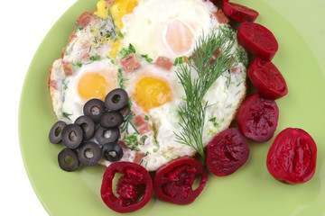 fried eggs and red eggplant