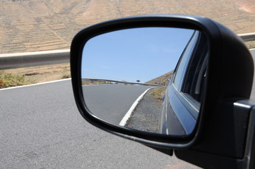 Fototapeta premium Road in rear view mirror, Fuerteventura Spain