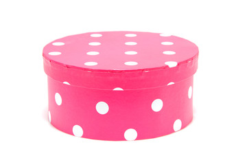 Round pink box with white dots