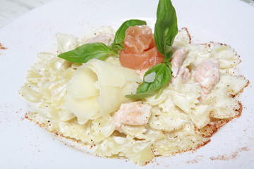 tasty pasta with cream, salmon cheese and cheese parmesan