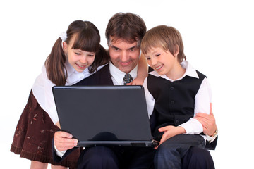 Father and kids on laptop