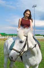 girl astride a horse