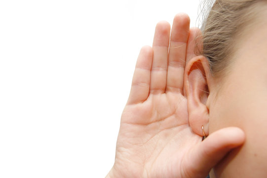 Girl Listening With Her Hand On An Ear