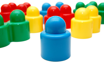 Plastic multi-coloured geometrical figures on a white background