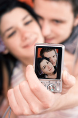 Happy couple taking their selfportraits