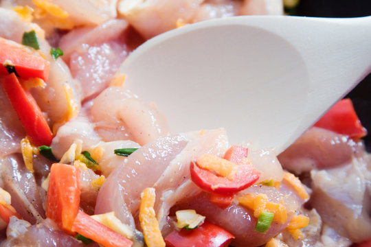 ooking - chicken breast and vegetables in a pan