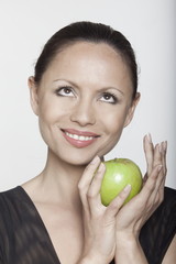 woman holding apple