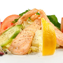 Salmon with vegetables isolated on white
