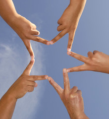 Hands together forming a star
