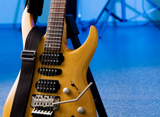 Toned maple electric guitar closeup