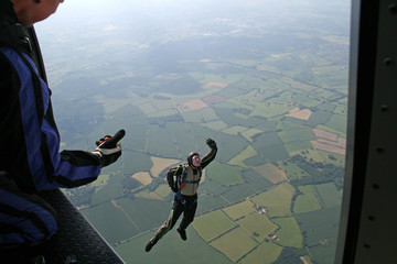 Student skydiver jumps from an airplane