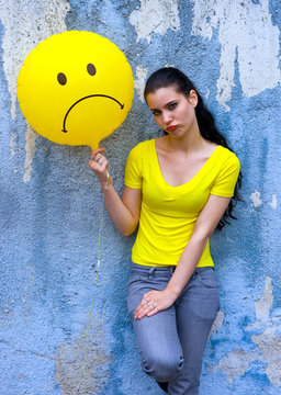 Teen Girl With Sad Smiley Balloon