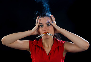 woman with four cigarettes in cloud of smoke