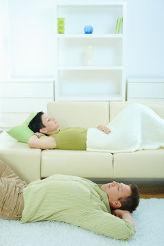 Couple sleeping at home