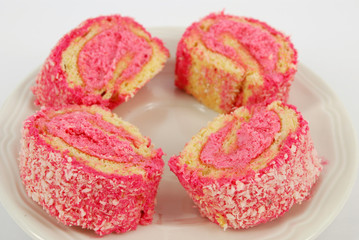 pink roll cake with coconut