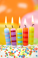 Birthday candles on colorful background