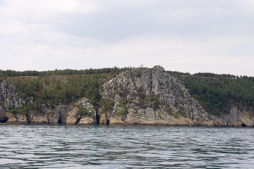 grotto in the rock, view by sea