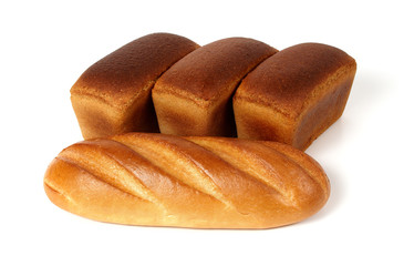A loaf of white bread and three loaves of rye bread