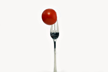 Tomate auf einer Gabel