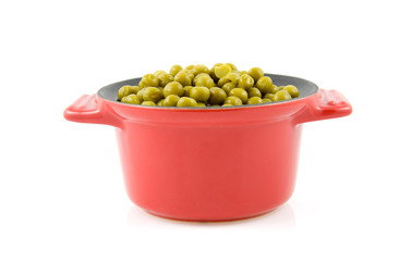 fresh peas in pan isolated on white background